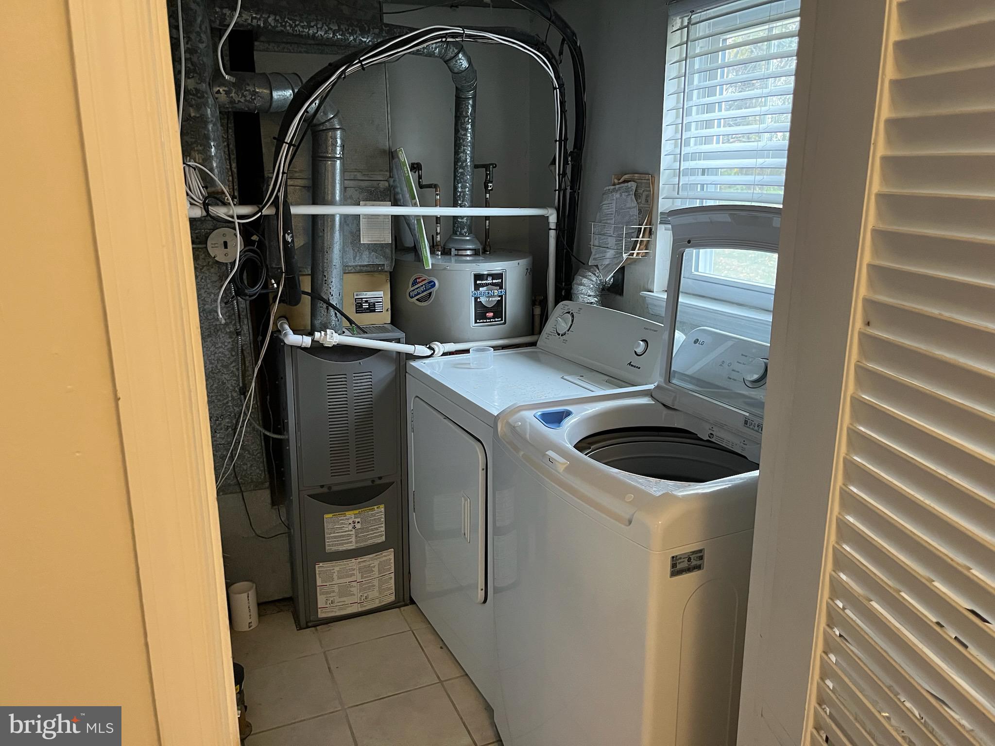 16 Apel Avenue, Unit D Oreland, PA 19075 - Photo 8 of 10 a utility room with dryer and washer