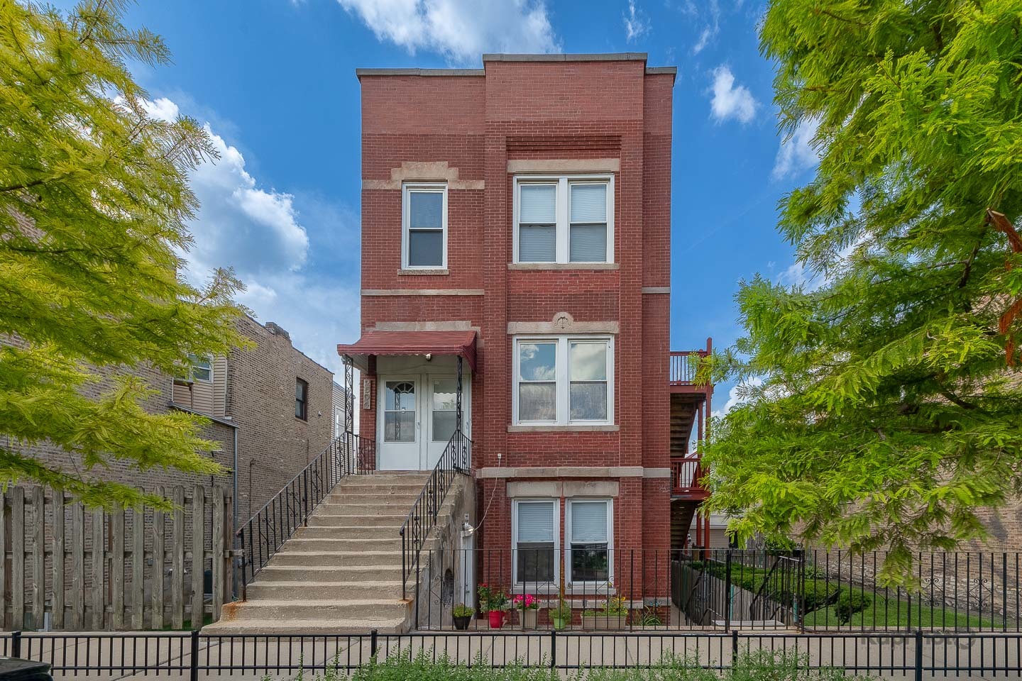 2504 South Blue Island Avenue, Unit 1R Chicago, IL 60608 - Photo 1 of 31 a view of a brick building with many windows