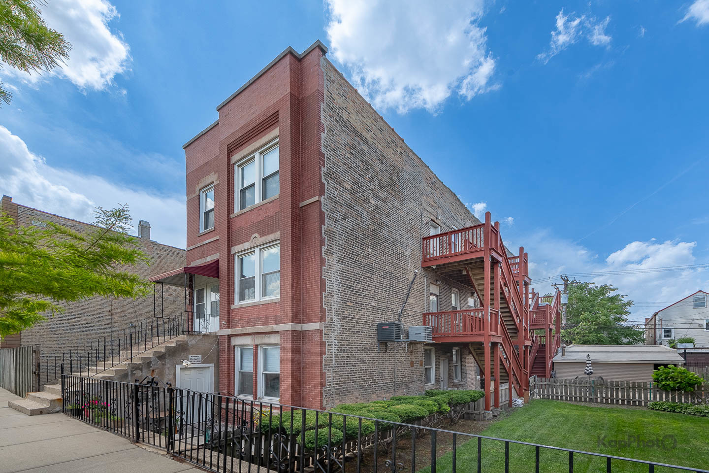 2504 South Blue Island Avenue, Unit 1R Chicago, IL 60608 - Photo 2 of 31 a view of a brick building next to a yard