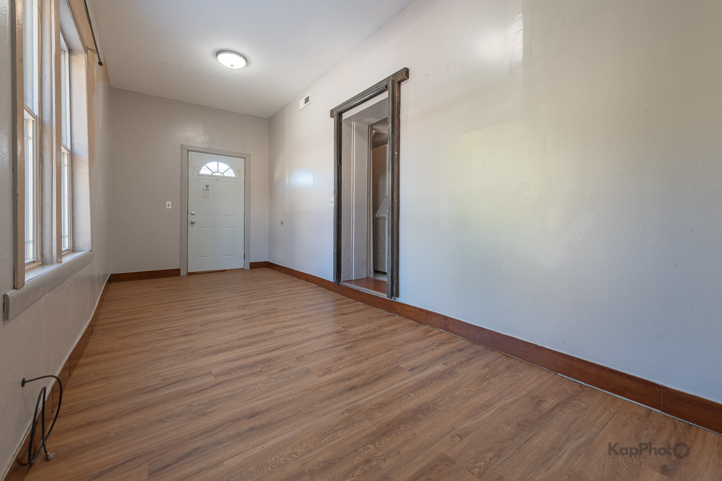 2504 South Blue Island Avenue, Unit 1R Chicago, IL 60608 - Photo 21 of 31 an empty room with wooden floor and windows