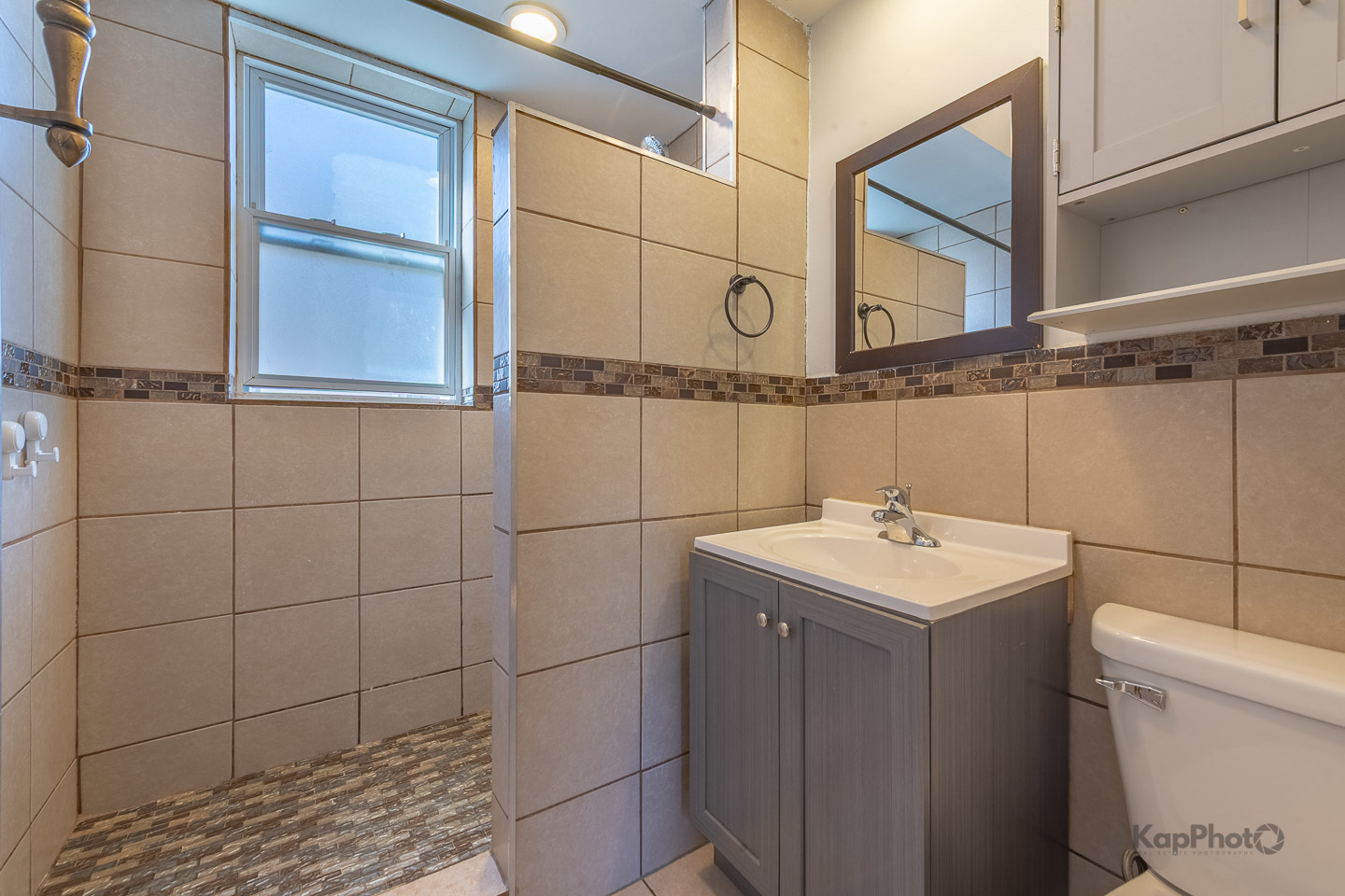 2504 South Blue Island Avenue, Unit 1R Chicago, IL 60608 - Photo 22 of 31 a bathroom with a sink a toilet and a mirror