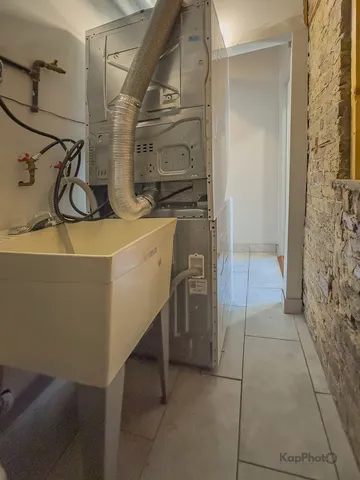 a view of entryway with wooden floor and stairs