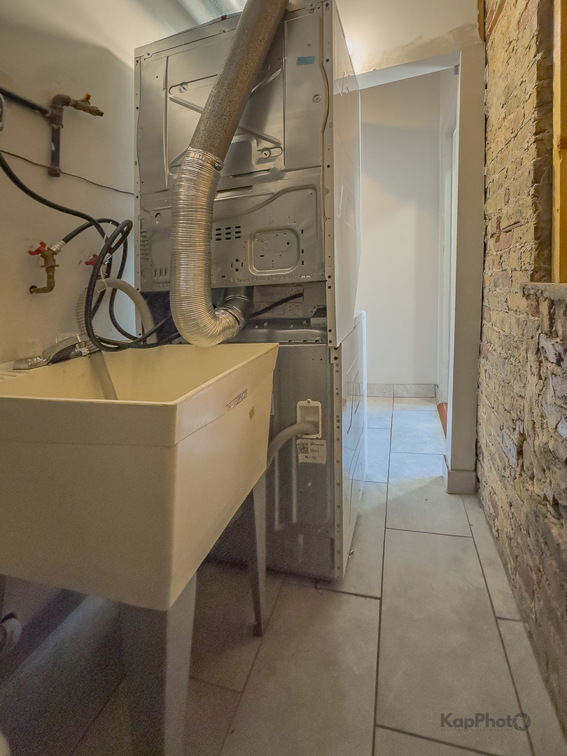 2504 South Blue Island Avenue, Unit 1R Chicago, IL 60608 - Photo 27 of 31 a bathroom with a sink and a shower