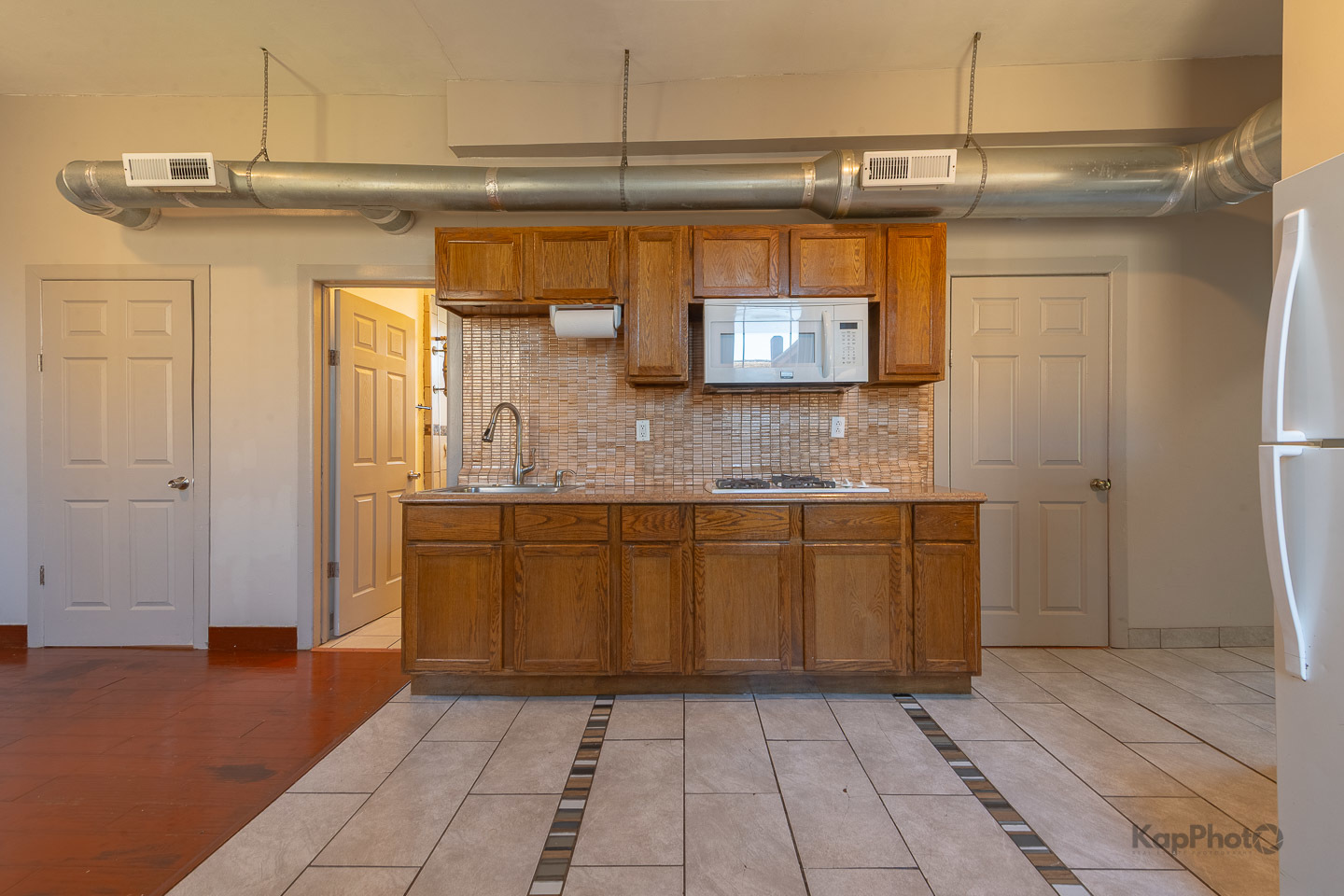 2504 South Blue Island Avenue, Unit 1R Chicago, IL 60608 - Photo 9 of 31 a bathroom with a mirror and a shower