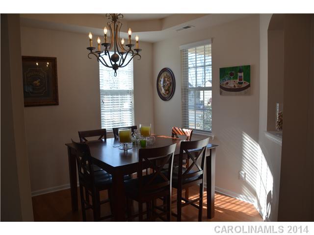 6533 Del Rio Road Charlotte, NC 28277 - Photo 3 of 15 a view of a dining room with furniture and chandelier
