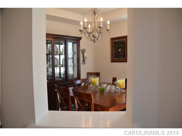 6533 Del Rio Road Charlotte, NC 28277 - Photo 4 of 15 a view of a dining room with furniture and chandelier
