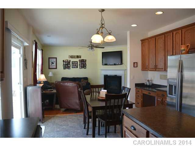 6533 Del Rio Road Charlotte, NC 28277 - Photo 8 of 15 a view of a dining room with furniture a chandelier and wooden floor