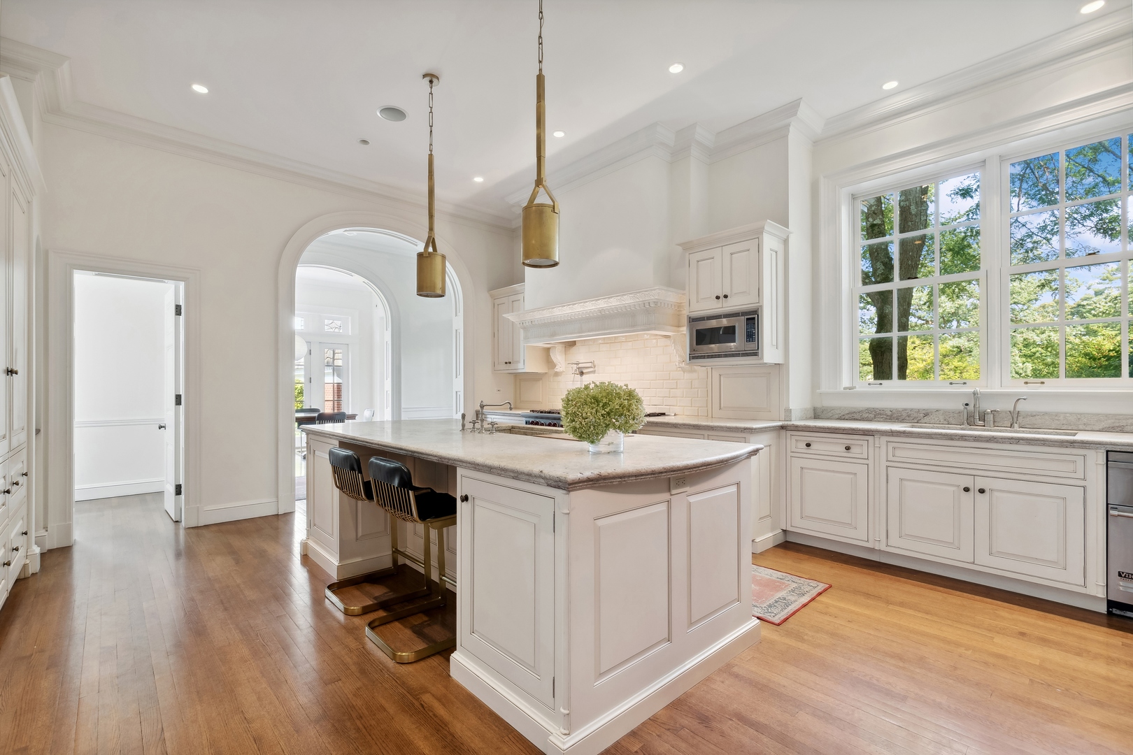 100 Pembroke Drive Lake Forest, IL 60045 - Photo 15 of 56 a kitchen with white cabinets and sink