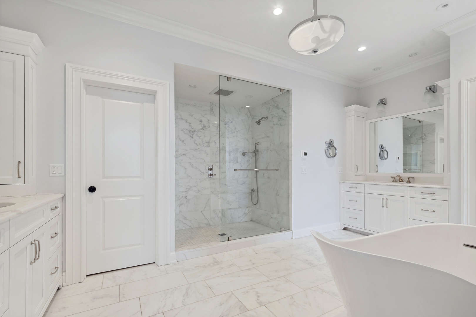 100 Pembroke Drive Lake Forest, IL 60045 - Photo 29 of 56 a spacious bathroom with a shower sink and mirror
