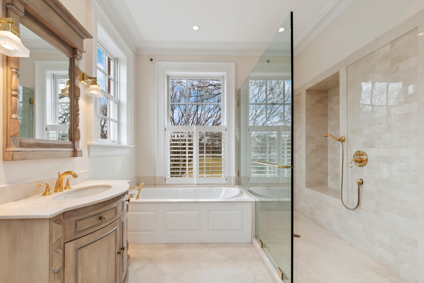 100 Pembroke Drive Lake Forest, IL 60045 - Photo 39 of 56 a bathroom with a granite countertop sink a mirror a shower and a bathtub