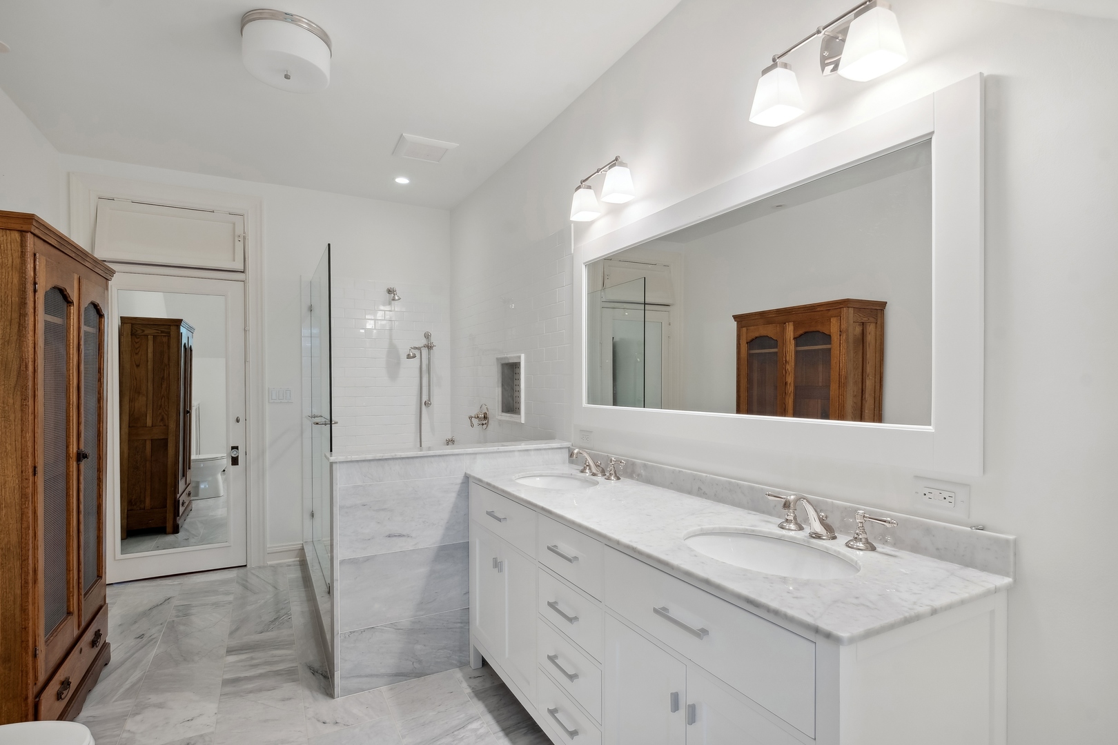 100 Pembroke Drive Lake Forest, IL 60045 - Photo 43 of 56 a bathroom with a granite countertop sink mirror and double