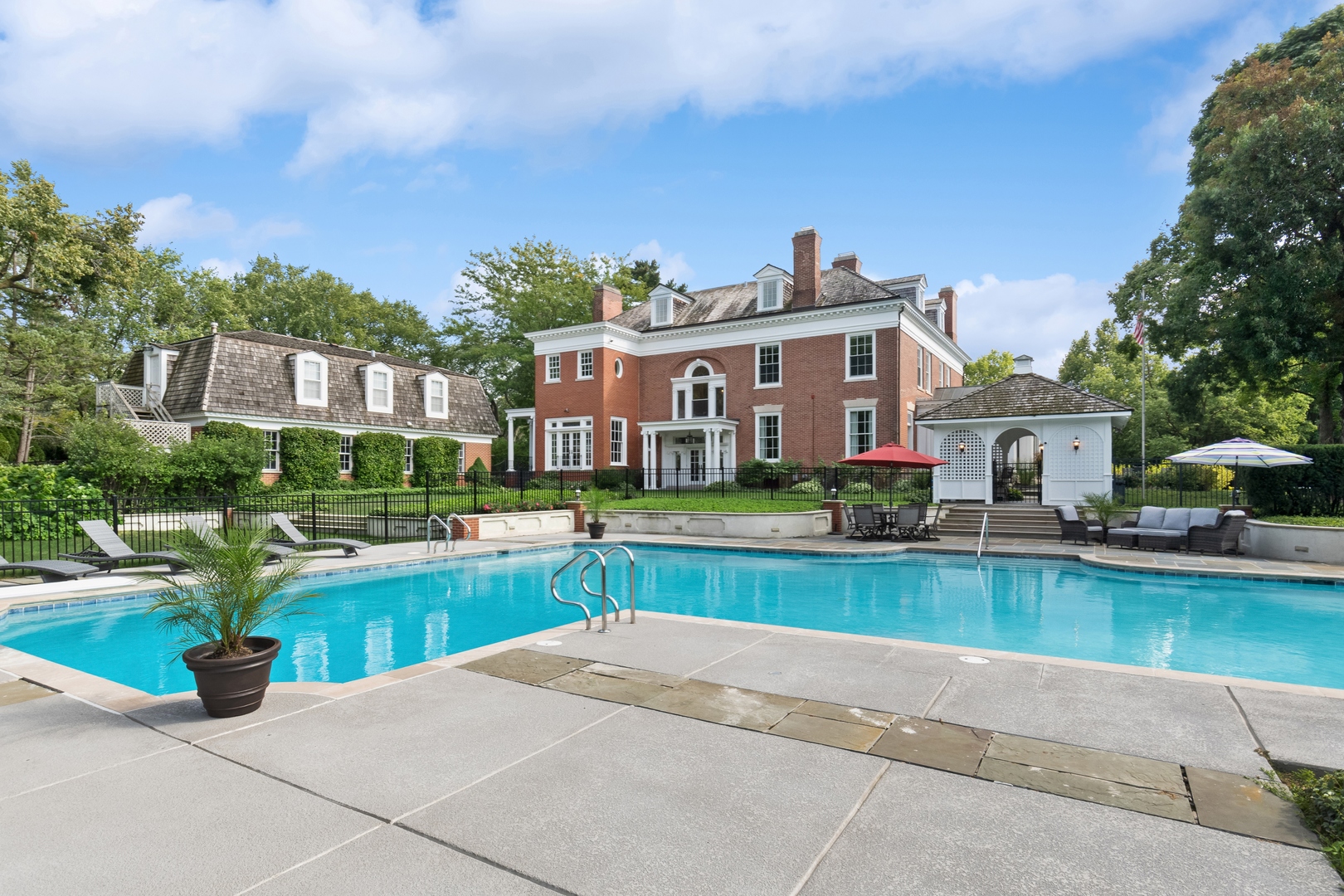 100 Pembroke Drive Lake Forest, IL 60045 - Photo 53 of 56 a view of a house with a backyard and a patio