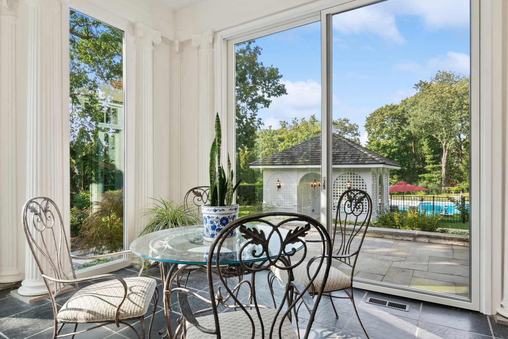 100 Pembroke Drive Lake Forest, IL 60045 - Photo 9 of 56 a view of a patio with table and chairs and potted plants