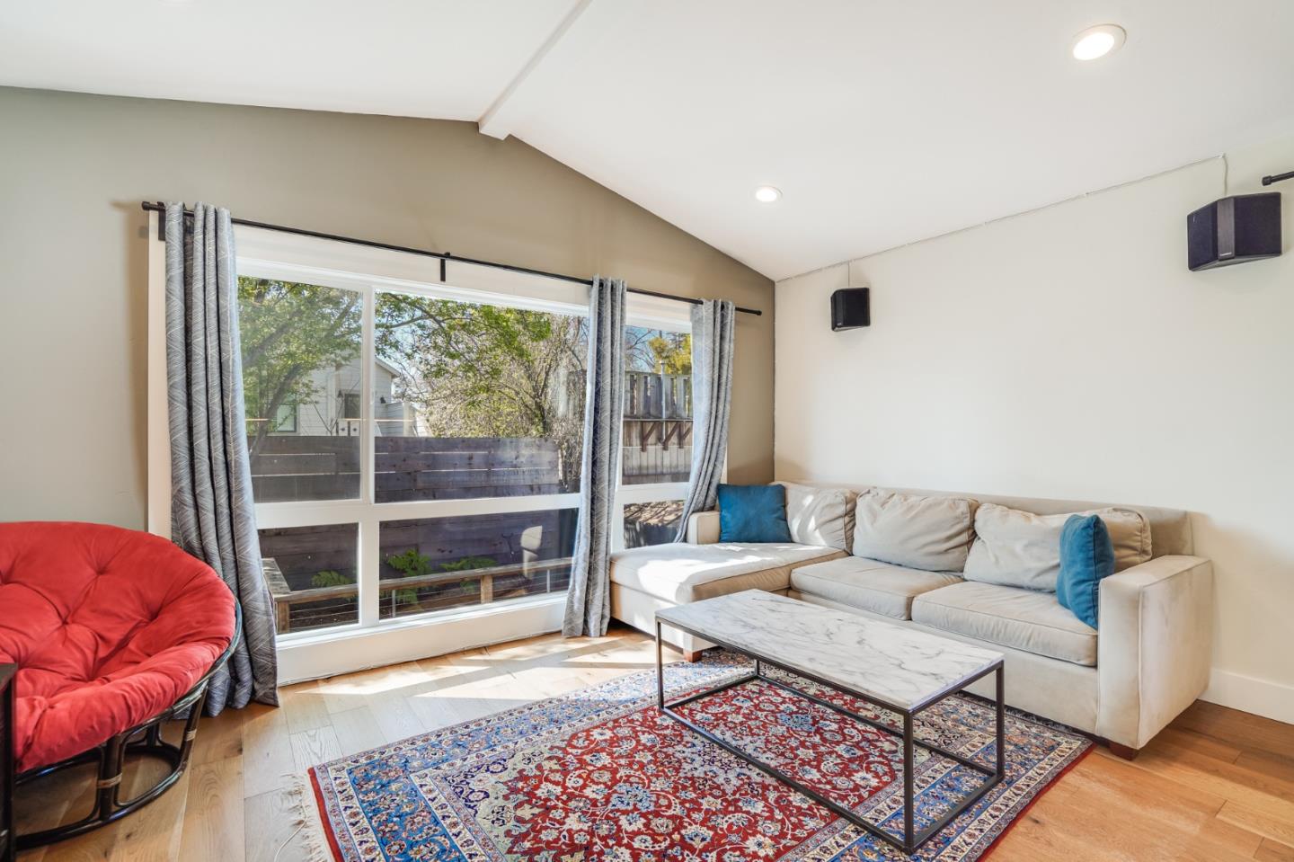 985 44th Street Oakland, CA 94608 - Photo 17 of 41 a living room with furniture and a large window