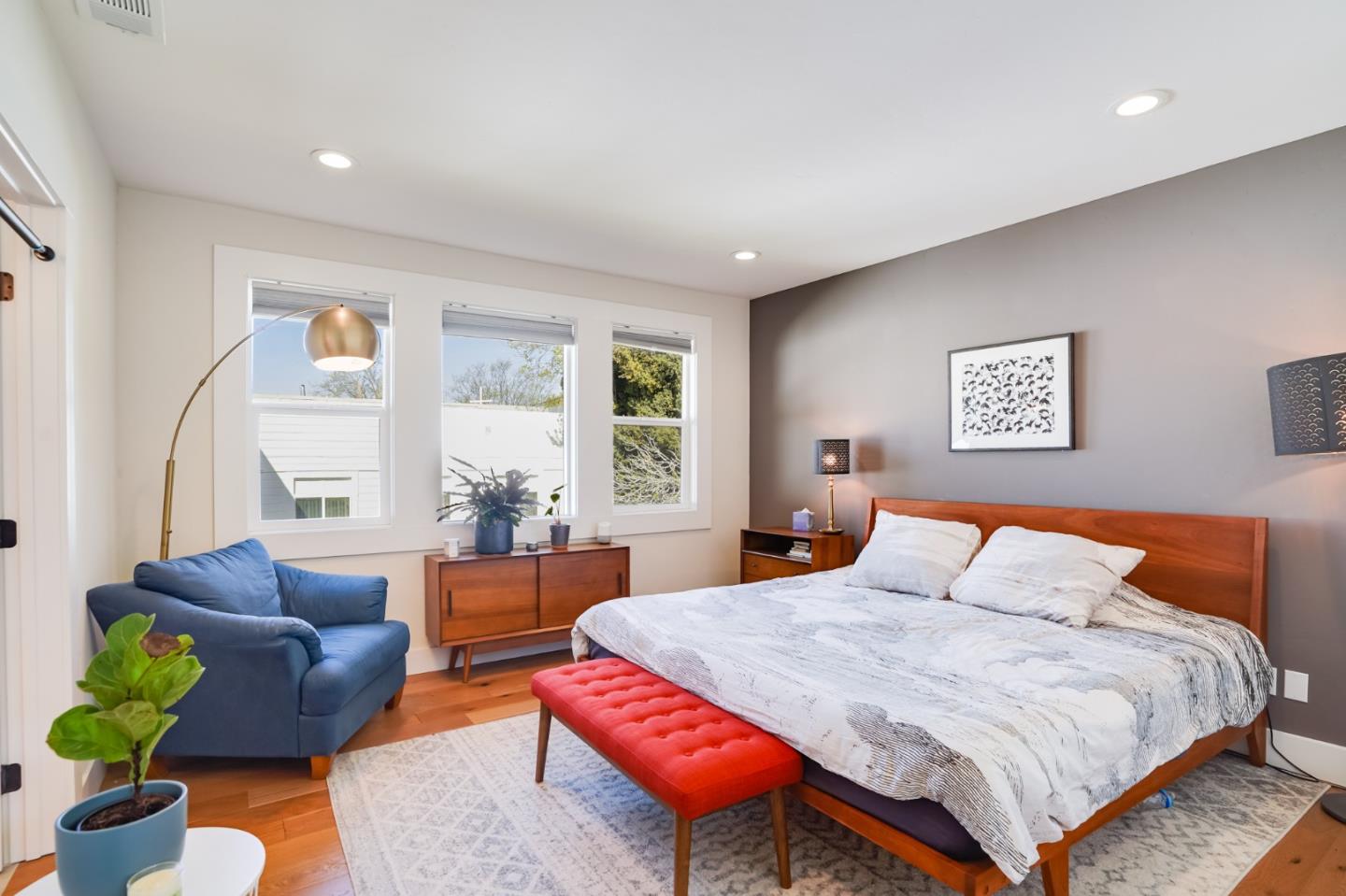 985 44th Street Oakland, CA 94608 - Photo 19 of 41 a bedroom with a bed and a couch