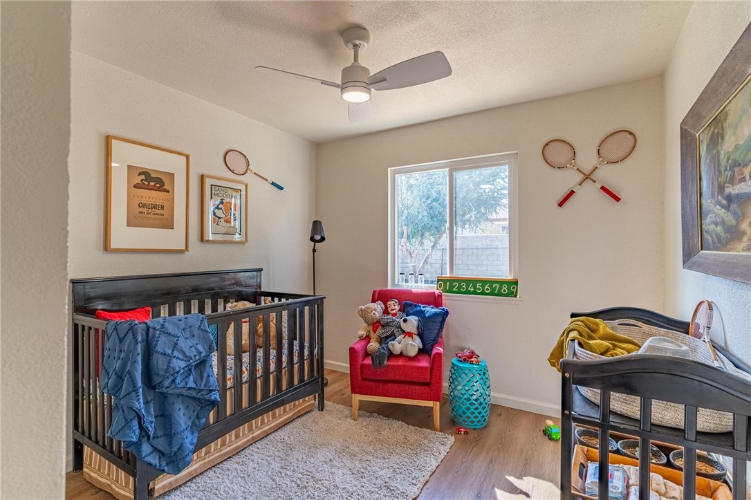 7738 Encinitas Avenue Fontana, CA 92336 - Photo 17 of 35 a bedroom with furniture and a window