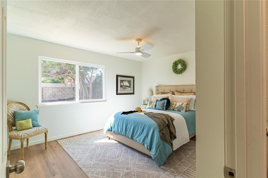 7738 Encinitas Avenue Fontana, CA 92336 - Photo 18 of 35 a bedroom with a bed and window