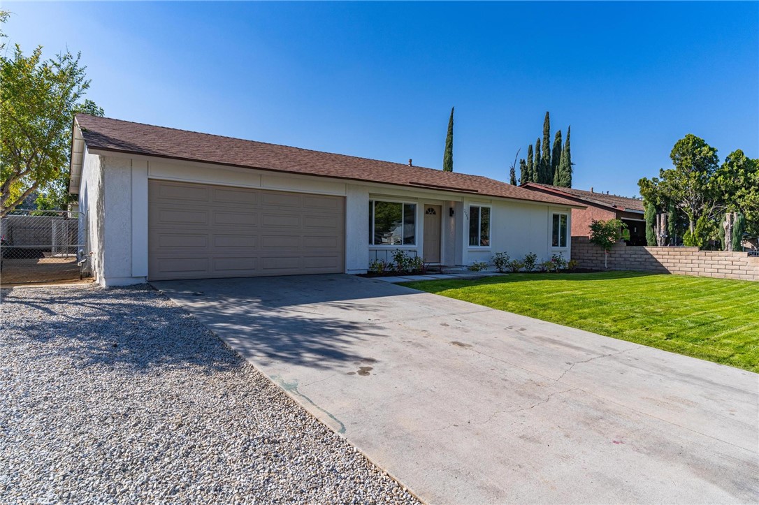 7738 Encinitas Avenue Fontana, CA 92336 - Photo 3 of 35 a view of a house with a yard