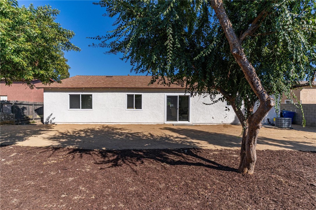 7738 Encinitas Avenue Fontana, CA 92336 - Photo 31 of 35 a view of house with backyard space and garden