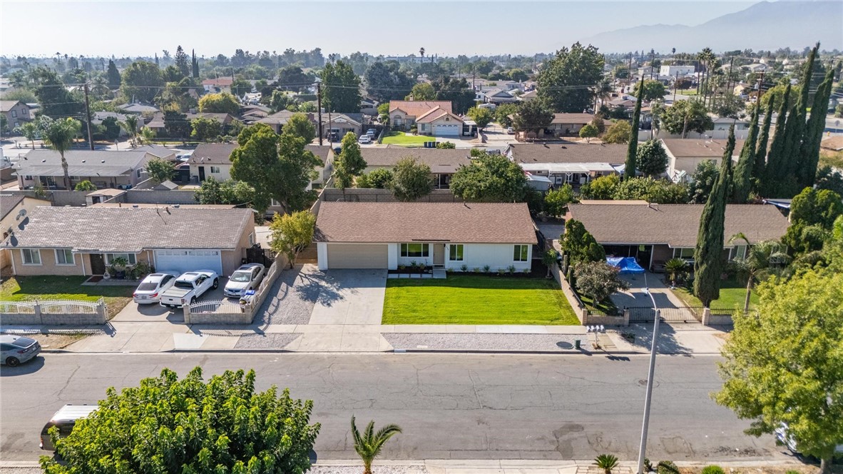 7738 Encinitas Avenue Fontana, CA 92336 - Photo 34 of 35 an aerial view of a house with a yard and a garden