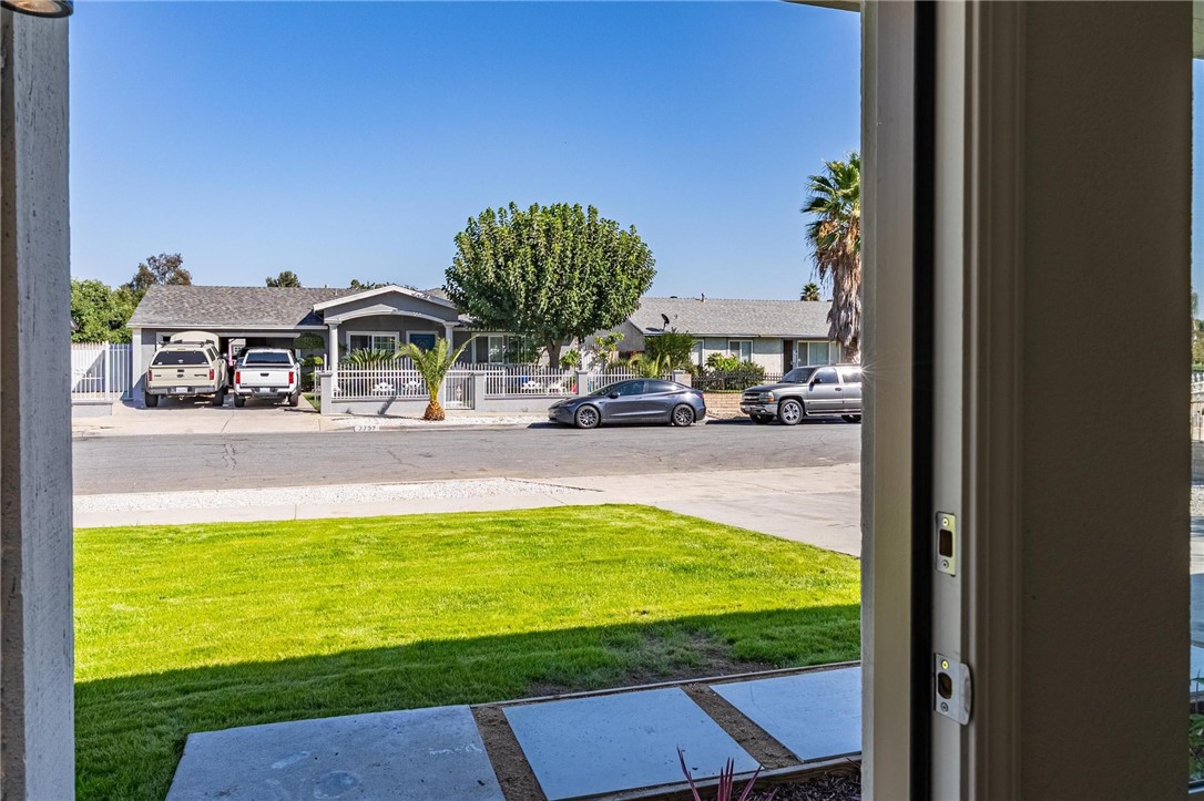 7738 Encinitas Avenue Fontana, CA 92336 - Photo 7 of 35 a view of a swimming pool and a yard