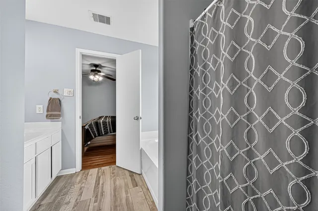 a view of a bedroom with a door and a rug
