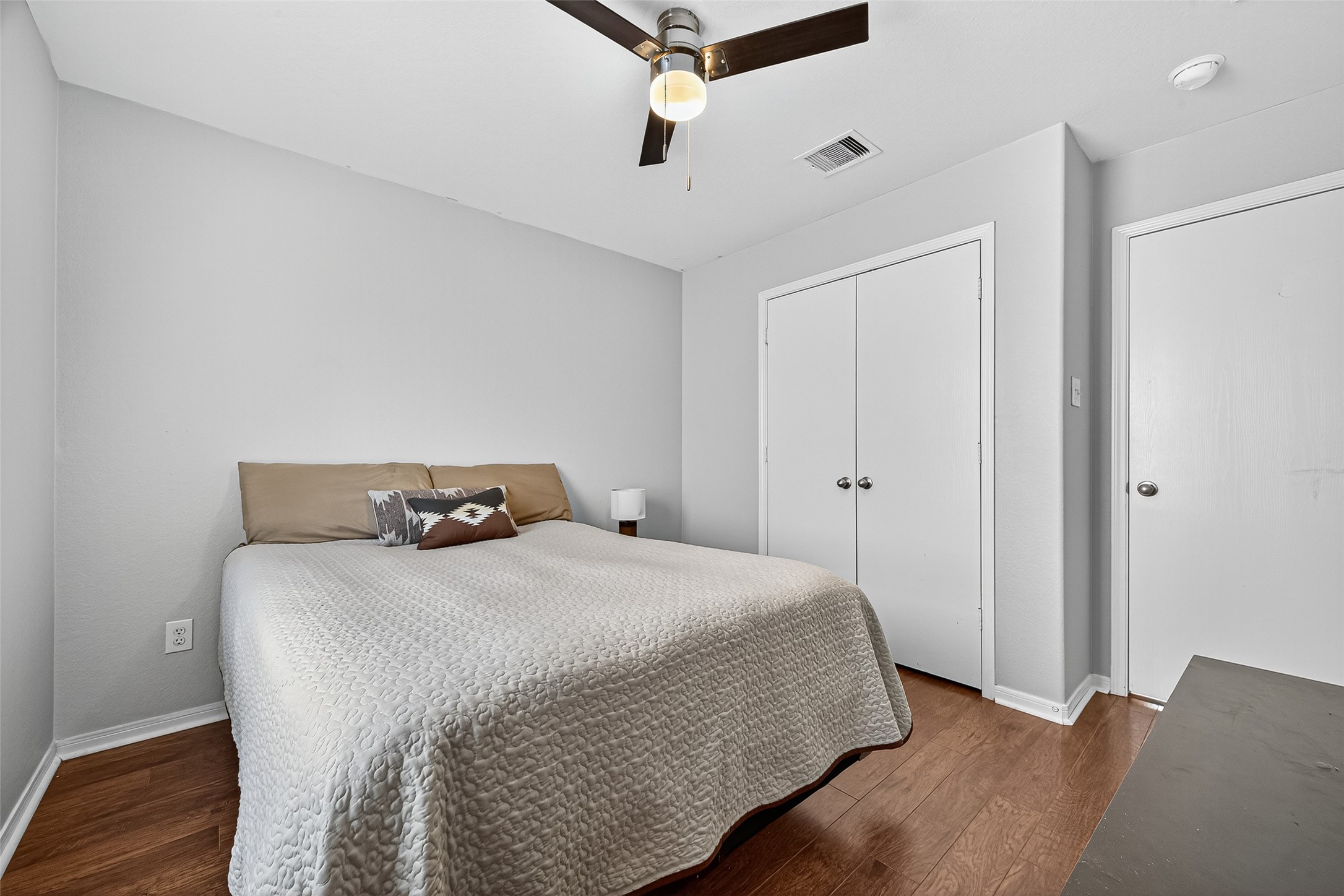 919 Wild Cotton Road Rosenberg, TX 77471 - Photo 14 of 21 a bedroom with a bed and wooden floor