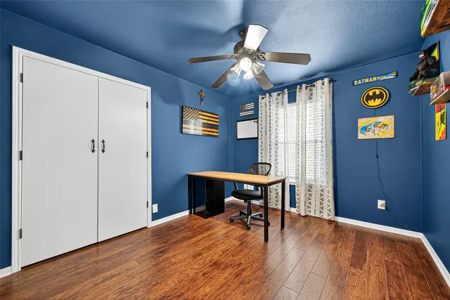 a view of a livingroom with furniture and a window