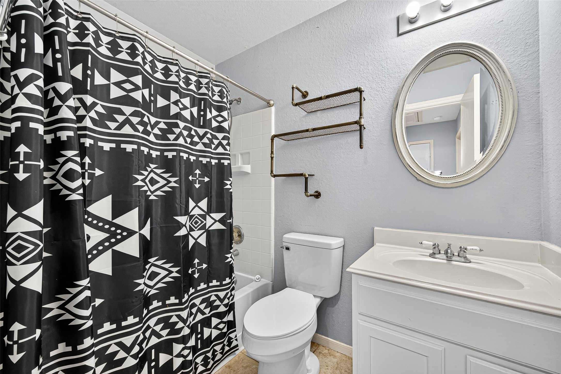 919 Wild Cotton Road Rosenberg, TX 77471 - Photo 16 of 21 a white toilet sitting next to a bathroom sink