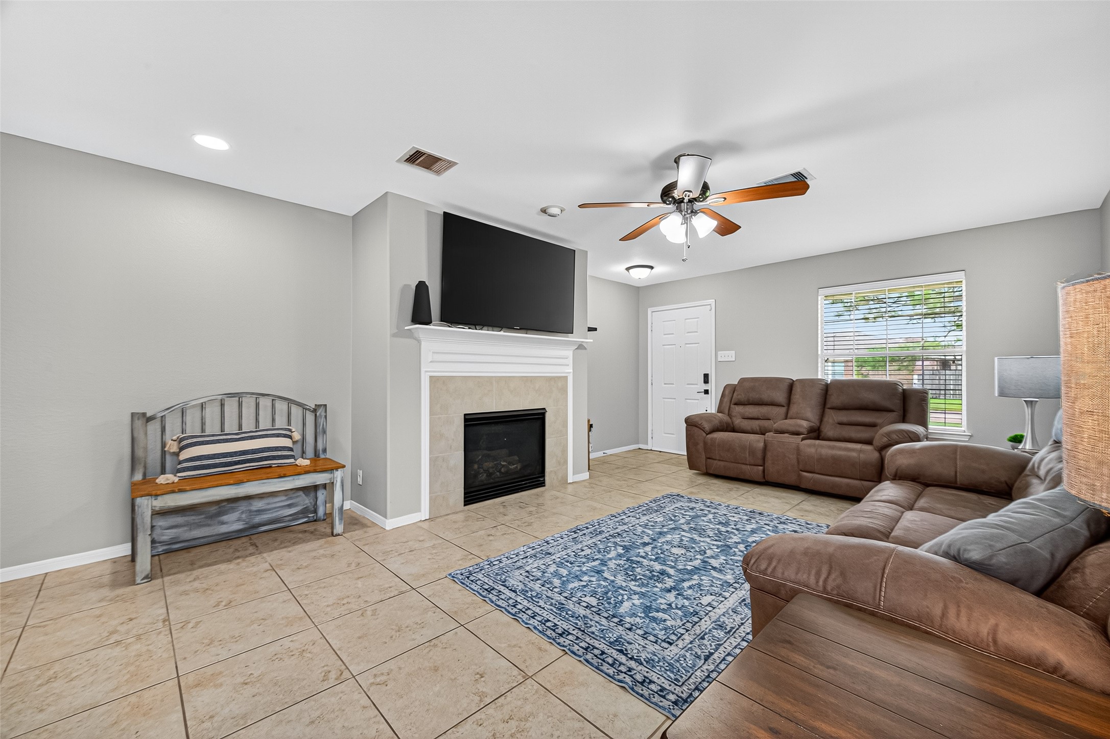 919 Wild Cotton Road Rosenberg, TX 77471 - Photo 4 of 21 a living room with furniture and a fireplace
