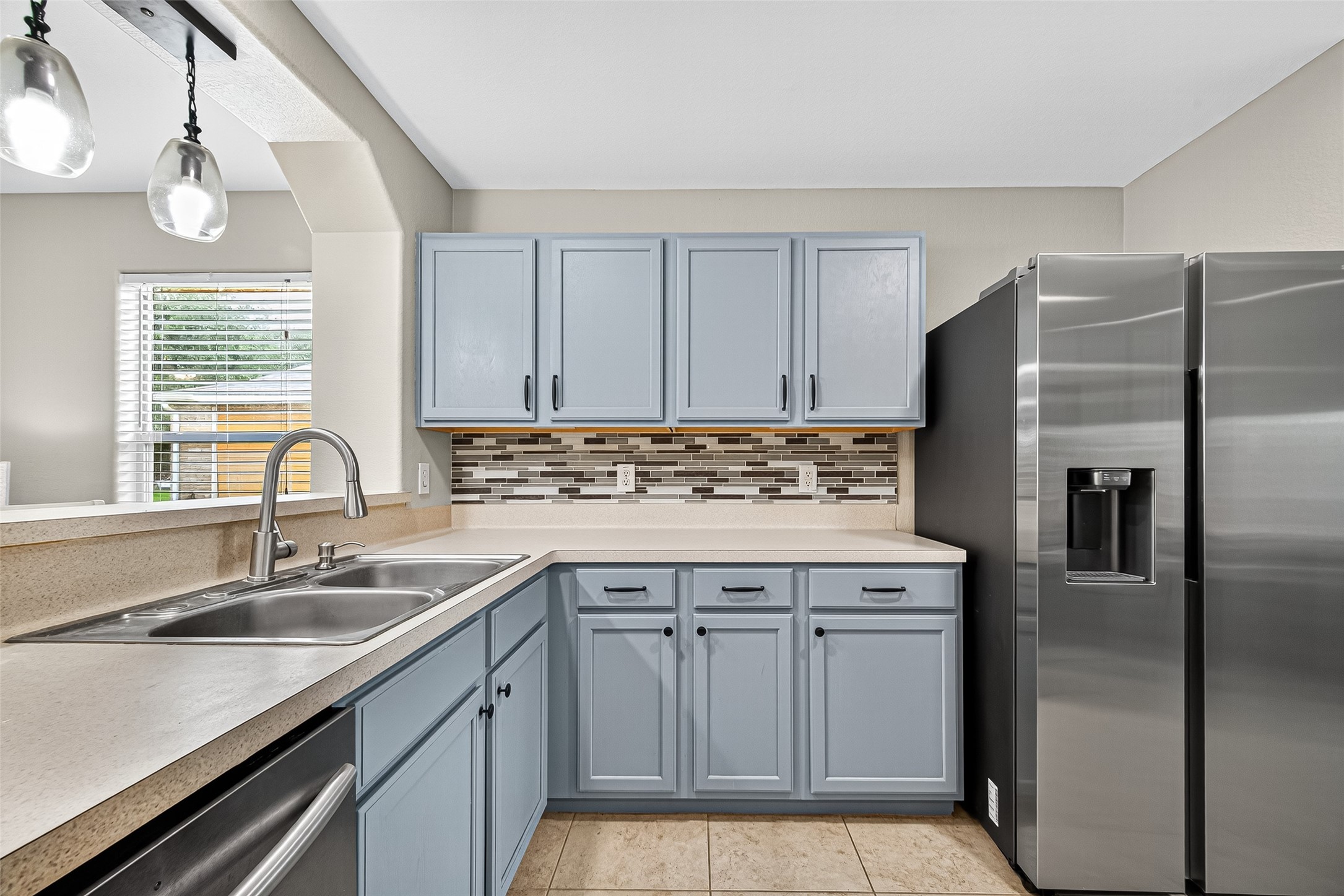 919 Wild Cotton Road Rosenberg, TX 77471 - Photo 7 of 21 a kitchen with cabinets appliances and a sink