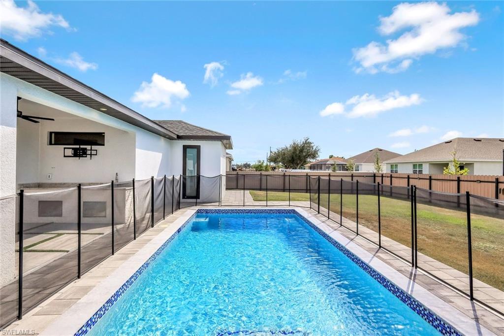 502 Southwest 25th Place Cape Coral, FL 33991 - Photo 12 of 34 a view of a house with a backyard