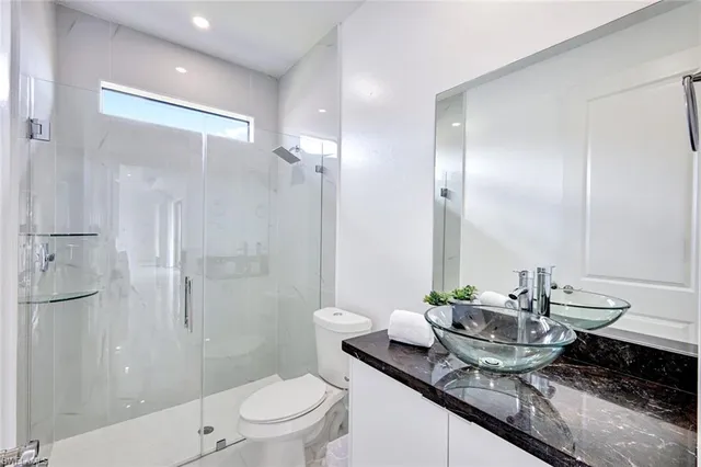 a bedroom with a bed and dresser