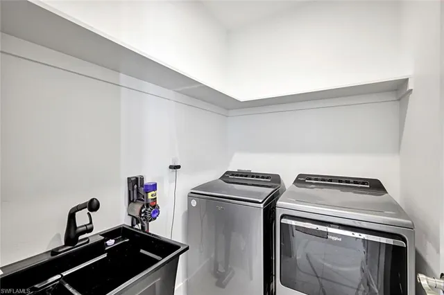 a view of room that has a white walls