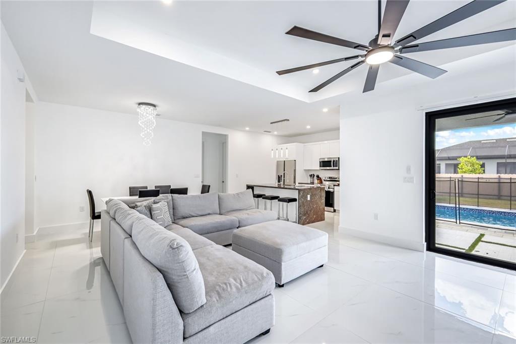502 Southwest 25th Place Cape Coral, FL 33991 - Photo 22 of 34 a living room with furniture and a large window
