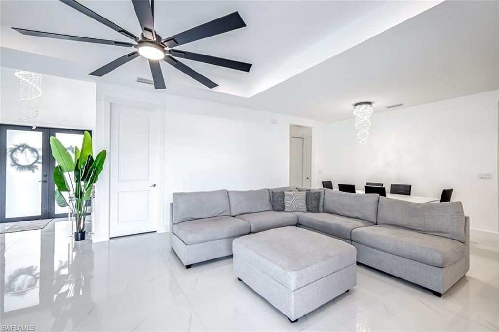 502 Southwest 25th Place Cape Coral, FL 33991 - Photo 33 of 34 a living room with furniture and a potted plant