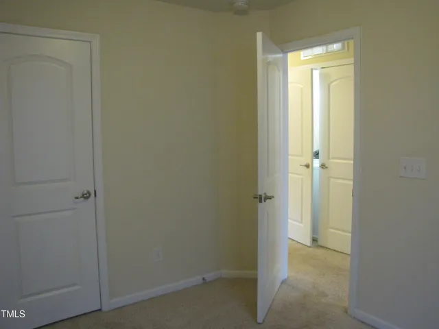 a view of a bathroom from the hallway