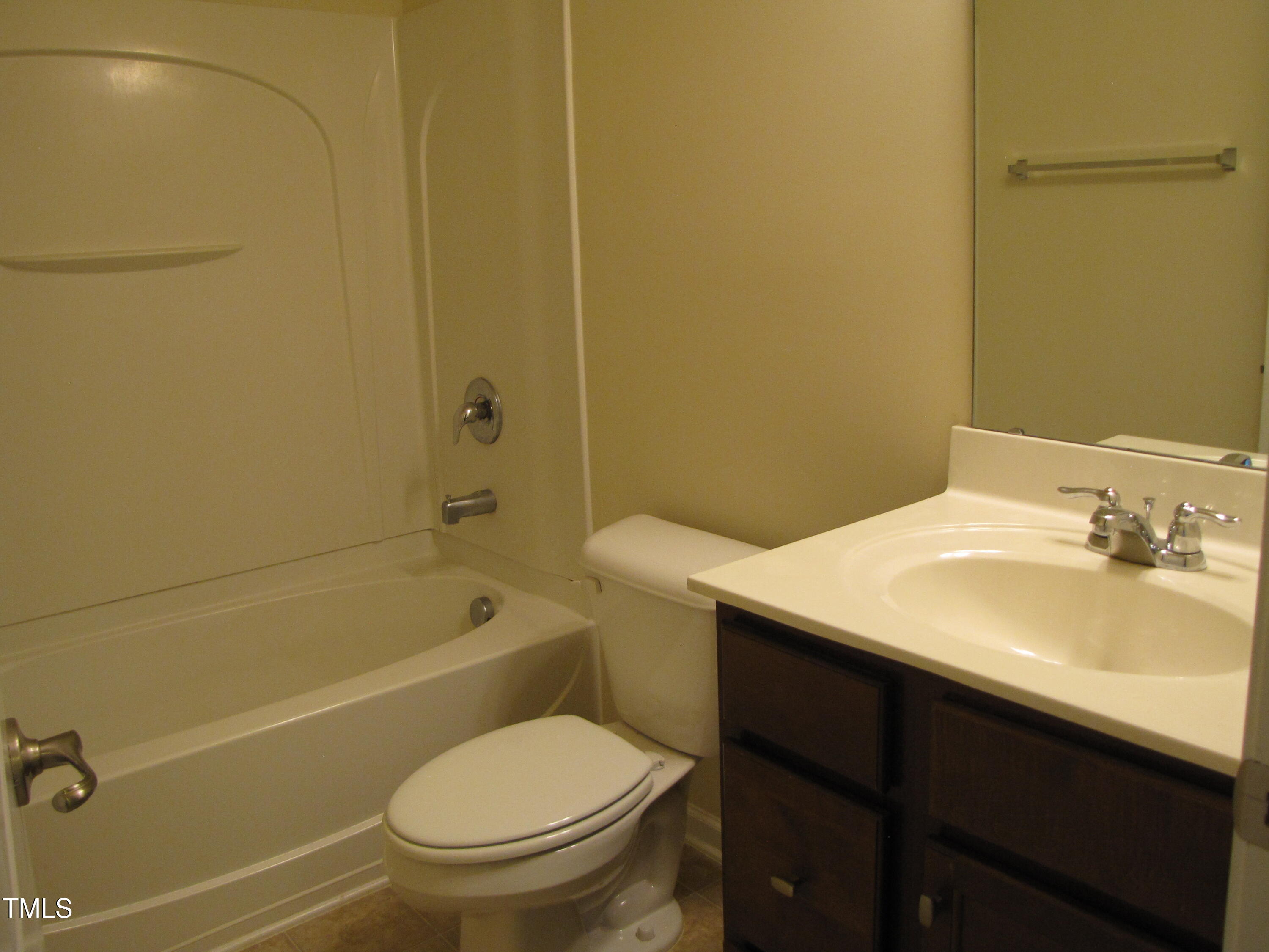 74 Pocono Drive Durham, NC 27705 - Photo 10 of 14 a bathroom with a sink a toilet and shower