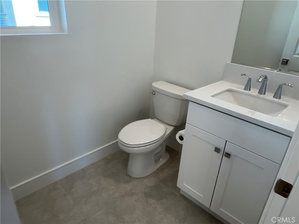 468 Palermo Lake Forest, CA 92630 - Photo 17 of 22 a white toilet sitting next to a bathroom sink