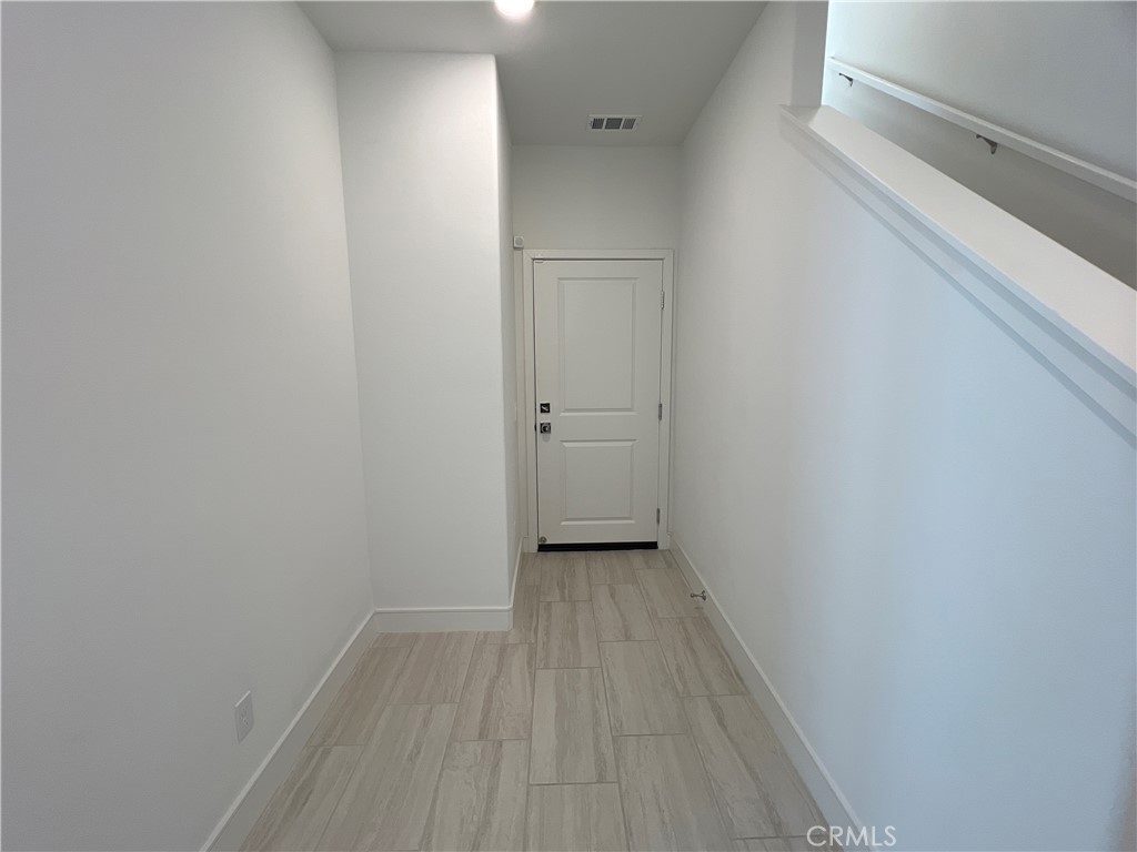 468 Palermo Lake Forest, CA 92630 - Photo 2 of 22 a view of a small space with wooden floor and a window