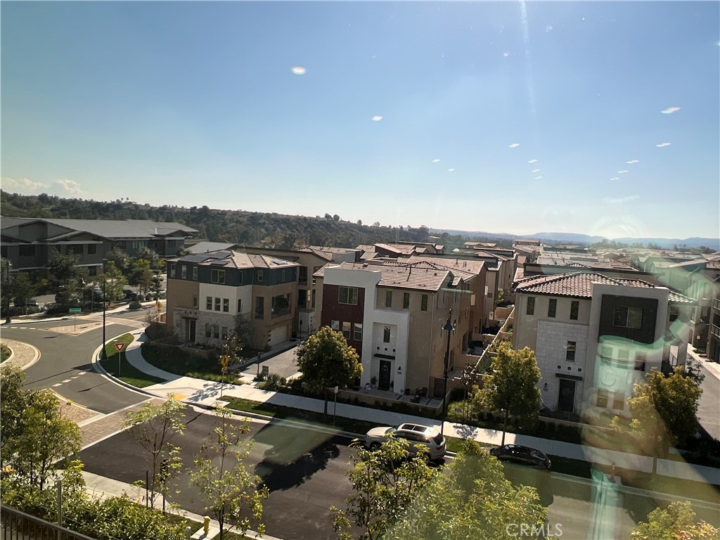 468 Palermo Lake Forest, CA 92630 - Photo 22 of 22 an aerial view of a house with a yard lake and mountain view in back