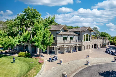 a view of a house with a flower garden