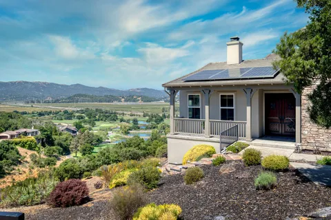 a swimming pool with outdoor seating and yard