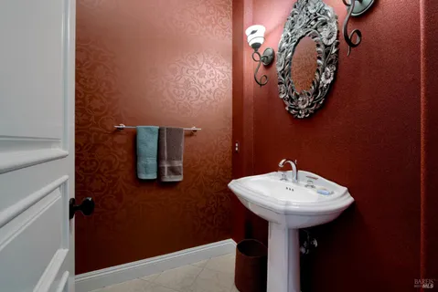 a kitchen with granite countertop a sink stove and cabinets
