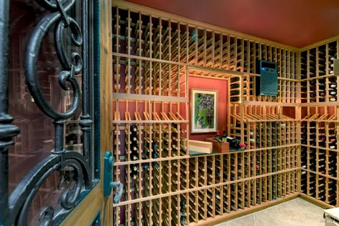 a bathroom with a glass door shower and a sink