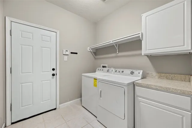 a bedroom with a bed and a potted plant