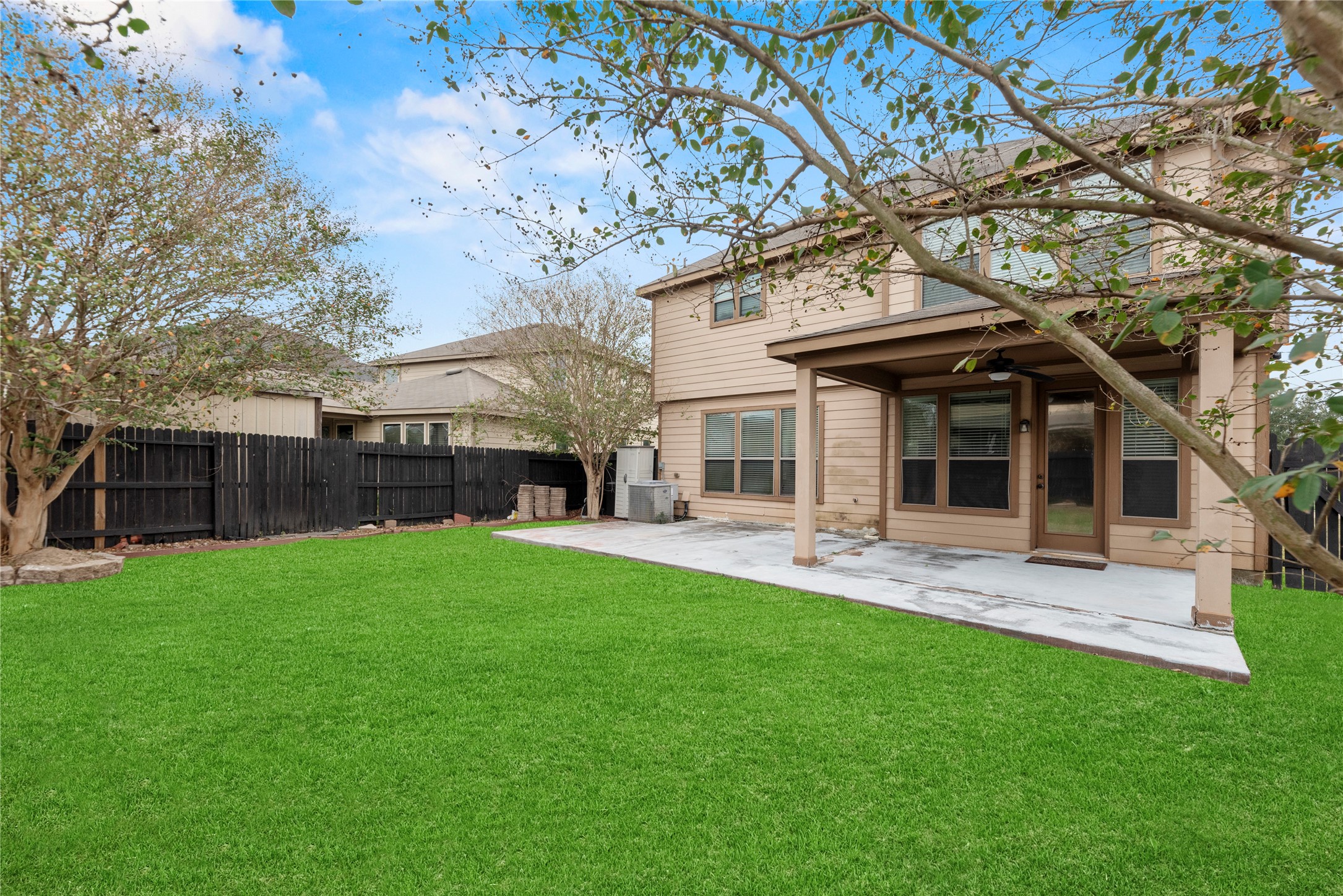 4103 Sherry Mist Lane Katy, TX 77449 - Photo 16 of 19 Step out and discover the inviting backyard, offering a wonderful green space for outdoor activities and relaxation. The backyard includes a full fence, a porch, and a sprinkler system for easy outdoor use and maintenance.
