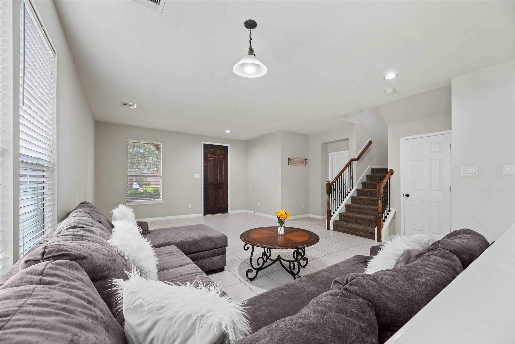 4103 Sherry Mist Lane Katy, TX 77449 - Photo 19 of 19 This spacious living area features an open layout with neutral finishes, offering a versatile space ideal for both relaxing and entertaining. The thoughtful floor plan allows for easy furniture placement and seamless flow throughout the home.