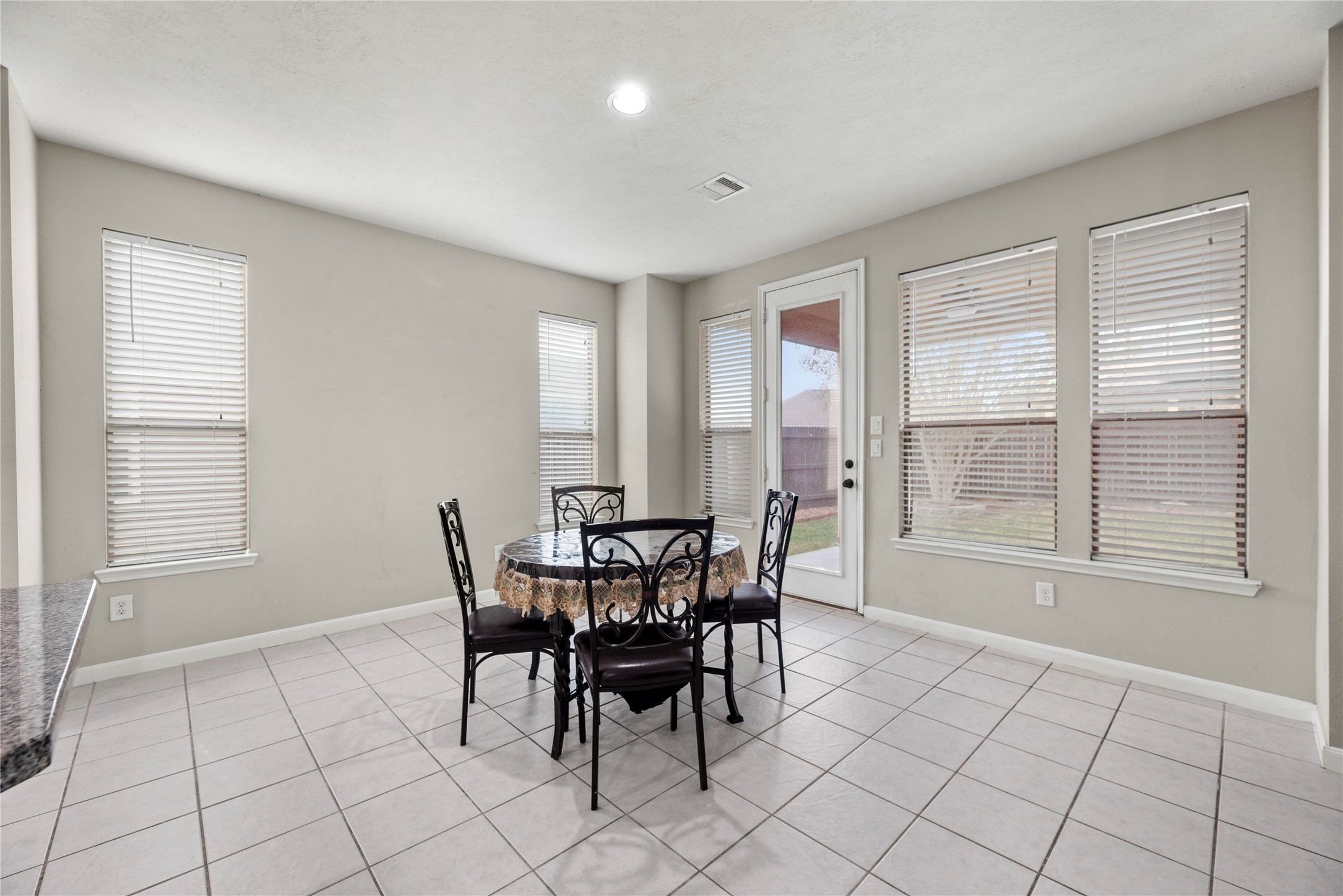 4103 Sherry Mist Lane Katy, TX 77449 - Photo 8 of 19 The dining area provides space for your table with room for extra seating and has direct access to the backyard.