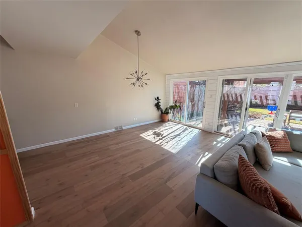 a living room with furniture and a rug